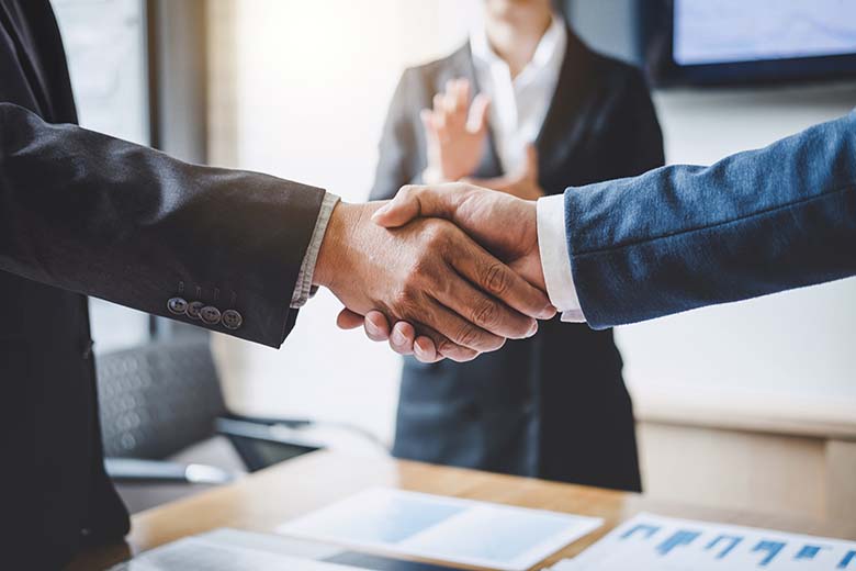 Finishing up a meeting, Business shaking hands after discussing